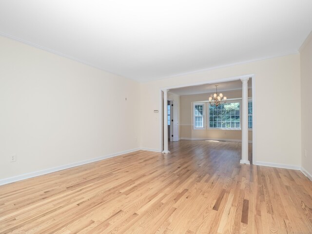 19 Prospect Rdg Apt 16, Ridgefield, CT 06877 - empty room featuring a chandelier, light wood-style floors, and crown molding