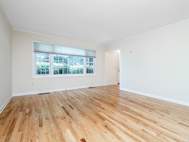 19 Prospect Rdg Apt 16, Ridgefield, CT 06877 - spare room featuring crown molding and light wood-type flooring