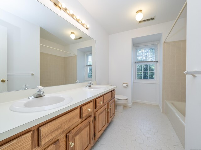 19 Prospect Rdg Apt 16, Ridgefield, CT 06877 - bathroom with double vanity, healthy amount of natural light, tile patterned floors, and bathing tub / shower combination