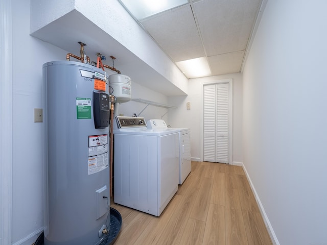 19 Prospect Rdg Apt 16, Ridgefield, CT 06877 - laundry area featuring water heater, washer and clothes dryer, and light wood-type flooring