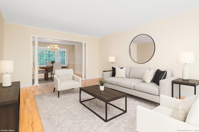 19 Prospect Rdg Apt 16, Ridgefield, CT 06877 - living area featuring a chandelier, light wood-style flooring, and ornamental molding