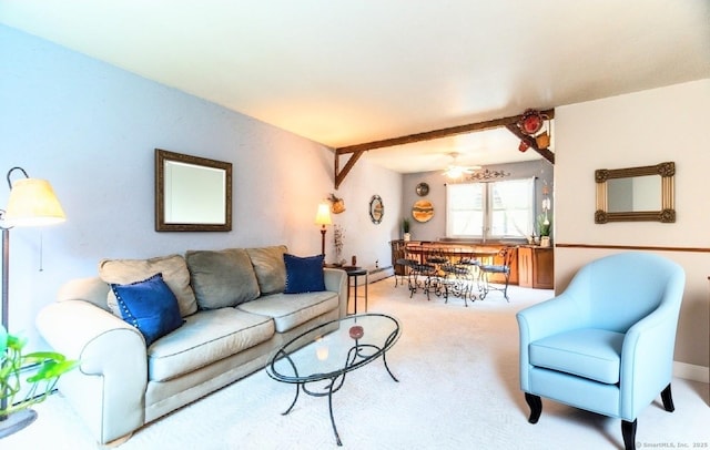 carpeted living area featuring ceiling fan