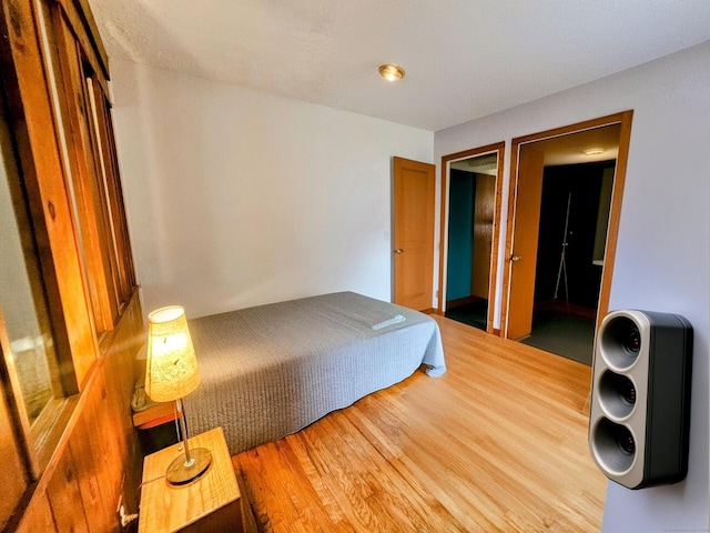 bedroom with wood finished floors