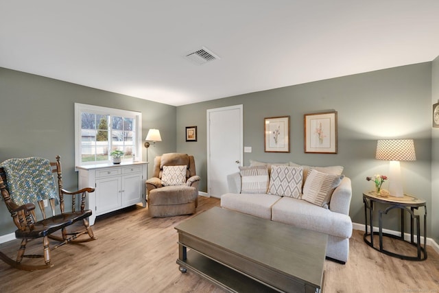 12 Nevins Ave, Enfield, CT 06082 - living room featuring light wood-style flooring and baseboards