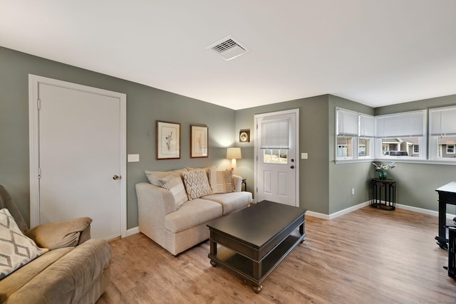 12 Nevins Ave, Enfield, CT 06082 - living area with light wood-type flooring and baseboards
