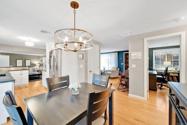 12 Nevins Ave, Enfield, CT 06082 - dining room featuring a chandelier, light wood-type flooring, and an office area