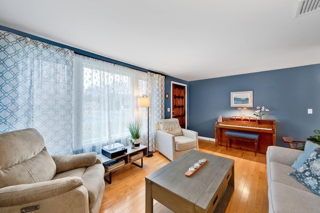 12 Nevins Ave, Enfield, CT 06082 - living room featuring light wood-style floors and baseboards