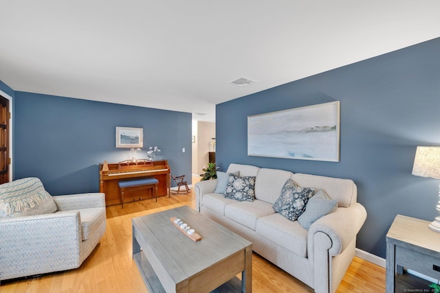 12 Nevins Ave, Enfield, CT 06082 - living room featuring light wood finished floors