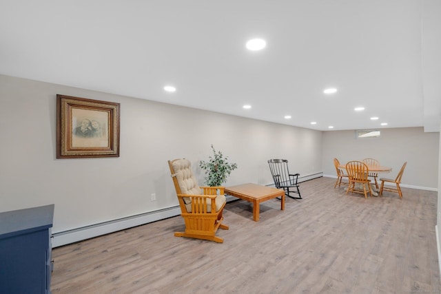 12 Nevins Ave, Enfield, CT 06082 - living area with a baseboard radiator, light wood-style flooring, recessed lighting, and baseboard heating