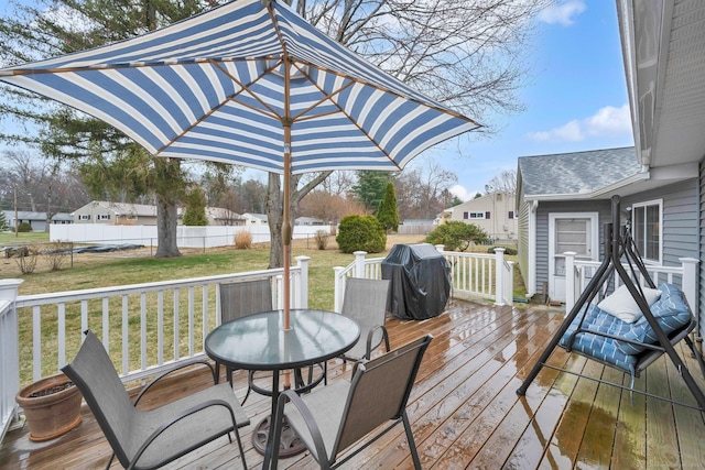 12 Nevins Ave, Enfield, CT 06082 - deck featuring grilling area, outdoor dining space, and a fenced backyard