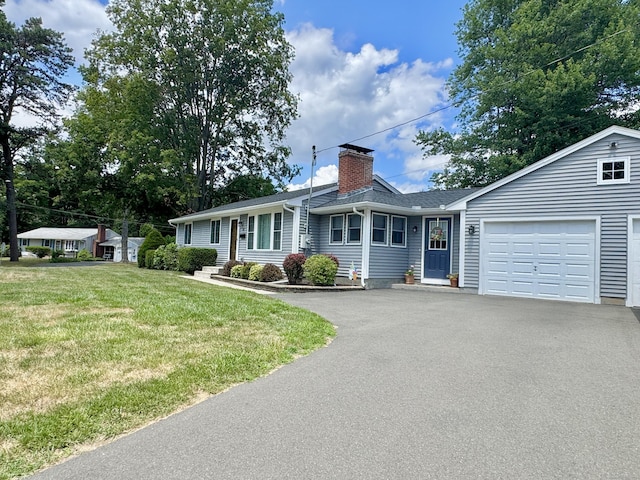 12 Nevins Ave, Enfield, CT 06082 - single story home with asphalt driveway, an attached garage, a chimney, a front lawn, and roof with shingles