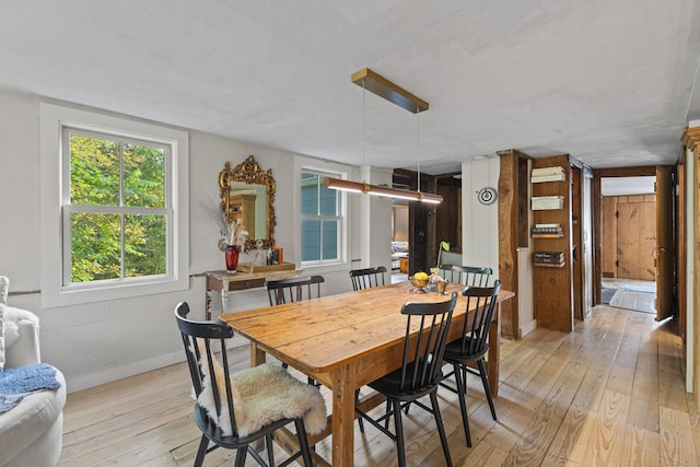 58 Middle Haddam Rd, East Hampton, CT 06456 - dining room with light wood-style floors and baseboards