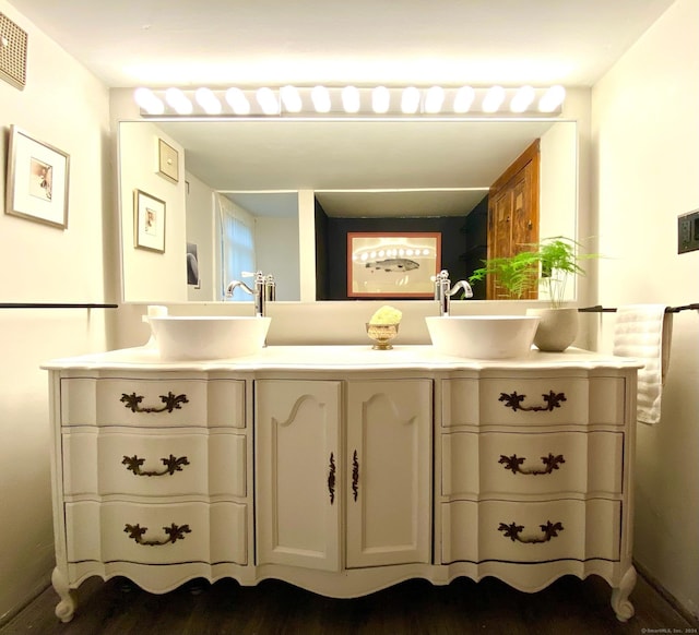 58 Middle Haddam Rd, East Hampton, CT 06456 - bathroom featuring double vanity and wood finished floors