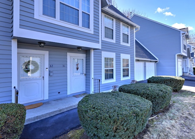 entrance to property featuring a garage