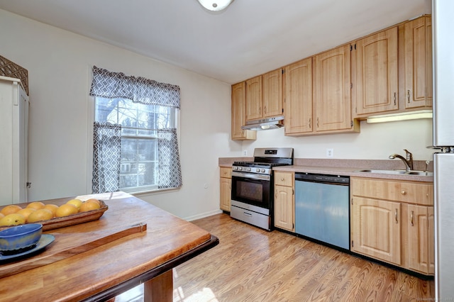 kitchen with a sink, stainless steel gas stove, dishwashing machine, and light brown cabinetry