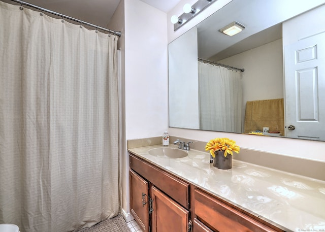 bathroom with tile patterned floors and vanity