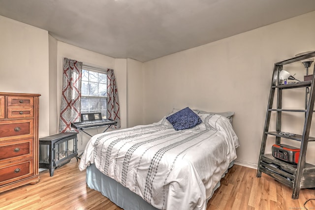 bedroom with light wood finished floors
