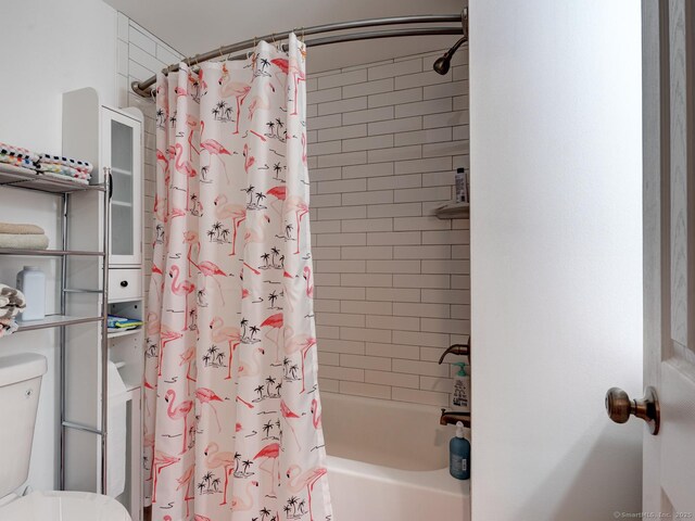 bathroom featuring toilet and shower / tub combo with curtain
