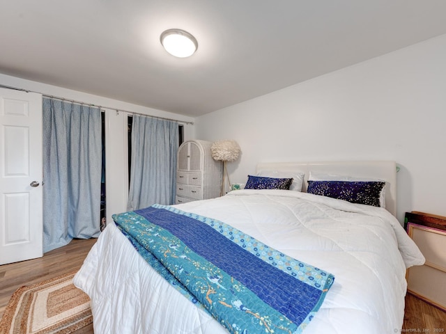 bedroom featuring wood finished floors