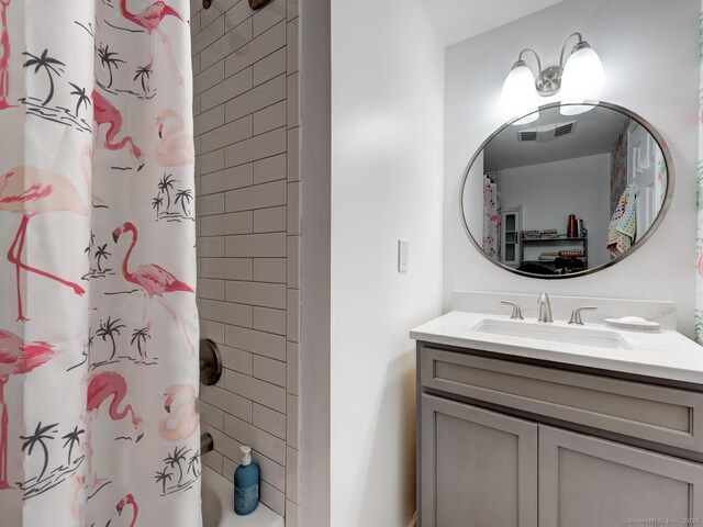 full bathroom featuring visible vents and vanity