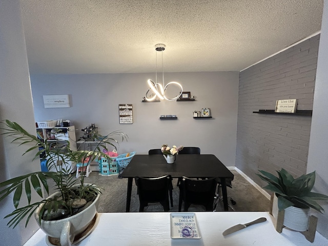 173 Russo Ave Unit 610, East Haven, CT 06513 - dining area featuring carpet floors, a chandelier, a textured ceiling, and brick wall