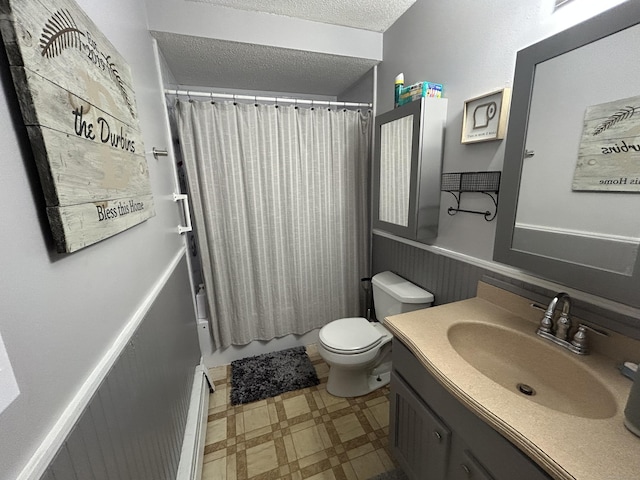 173 Russo Ave Unit 610, East Haven, CT 06513 - full bathroom with tile patterned floors, vanity, a textured ceiling, and shower / tub combo with curtain