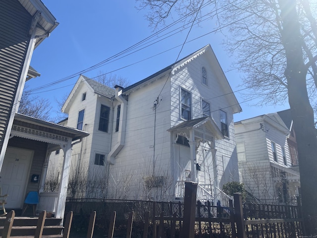 view of side of property with a fenced front yard