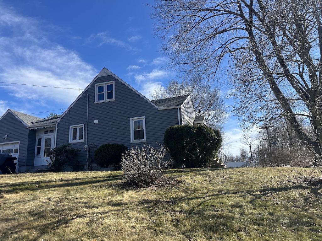 424 Long Hill Ave, Shelton, CT 06484 - view of property exterior featuring a lawn and a garage