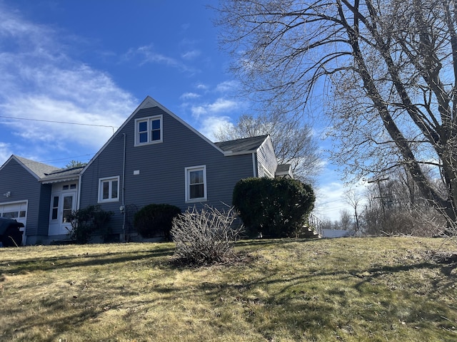 424 Long Hill Ave, Shelton, CT 06484 - view of property exterior featuring a lawn and a garage