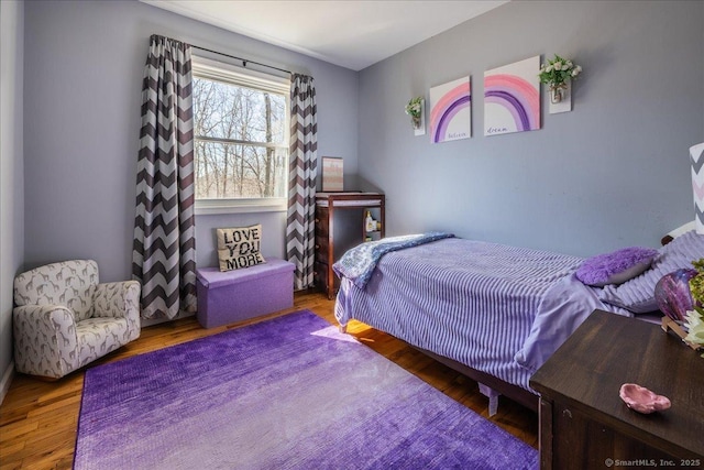 bedroom with wood finished floors