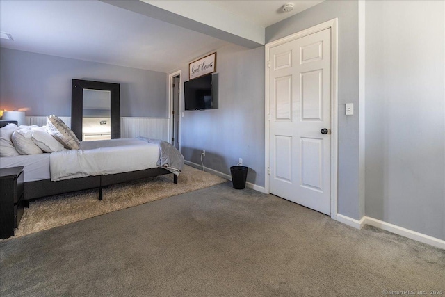 unfurnished bedroom with baseboards and carpet flooring