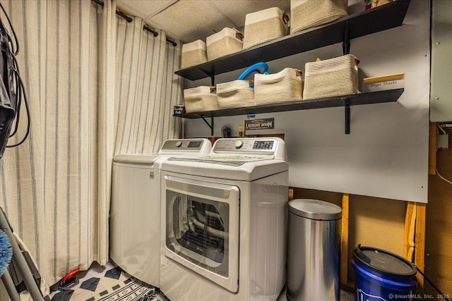 laundry area featuring separate washer and dryer and laundry area