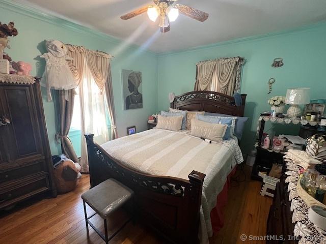 12 Avery St, Stonington, CT 06379 - bedroom featuring wood finished floors, crown molding, and ceiling fan