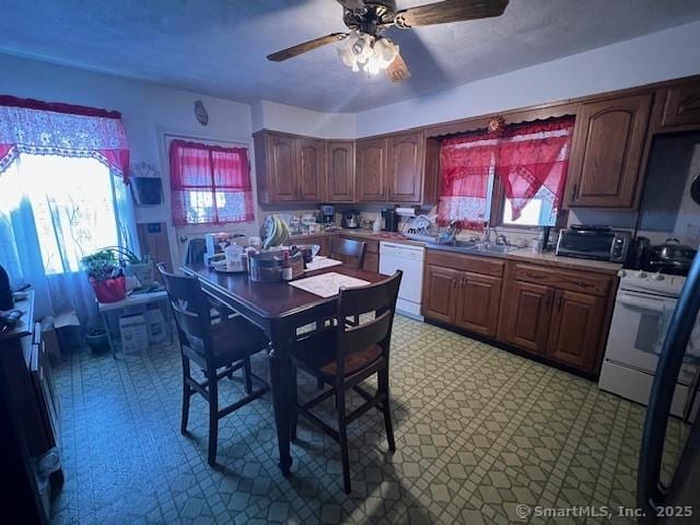 12 Avery St, Stonington, CT 06379 - kitchen featuring light floors, white appliances, and healthy amount of natural light