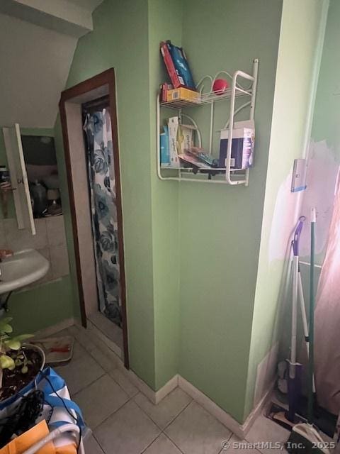 12 Avery St, Stonington, CT 06379 - bathroom with tile patterned flooring, baseboards, and a sink