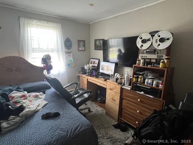 12 Avery St, Stonington, CT 06379 - carpeted bedroom with crown molding and a desk
