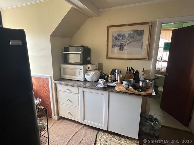 12 Avery St, Stonington, CT 06379 - bar featuring white microwave, freestanding refrigerator, light colored carpet, and ornamental molding