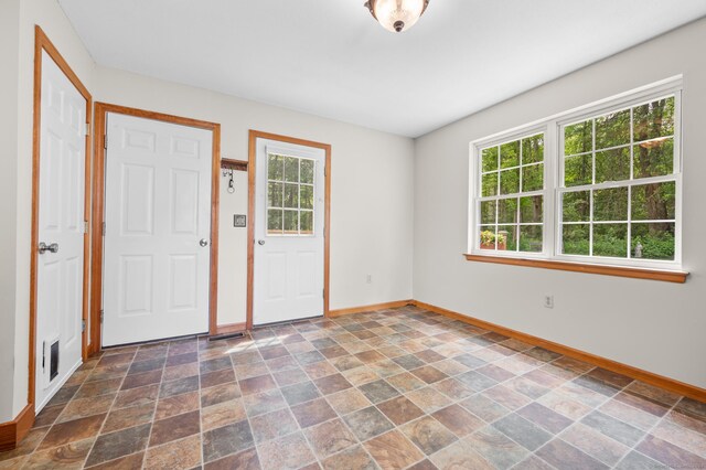 32 Pheasant Hill Dr Unit 32, Enfield, CT 06082 - foyer featuring healthy amount of natural light and dark stone finish floors