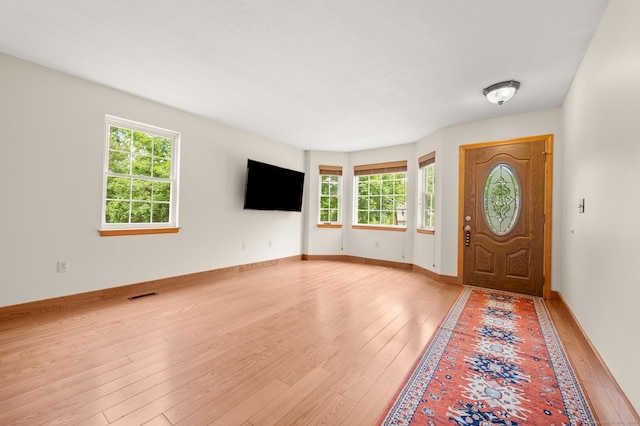 32 Pheasant Hill Dr Unit 32, Enfield, CT 06082 - foyer entrance featuring plenty of natural light and light wood finished floors