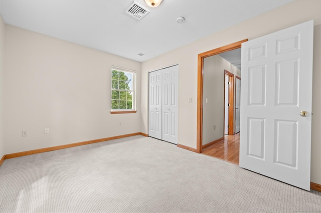 32 Pheasant Hill Dr Unit 32, Enfield, CT 06082 - unfurnished bedroom featuring light colored carpet and a closet