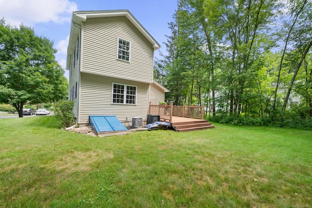 32 Pheasant Hill Dr Unit 32, Enfield, CT 06082 - back of house with a wooden deck and a yard