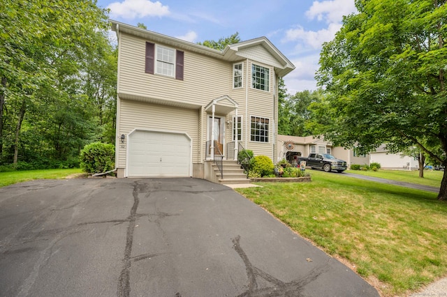 32 Pheasant Hill Dr Unit 32, Enfield, CT 06082 - traditional home with a garage, a front yard, and asphalt driveway