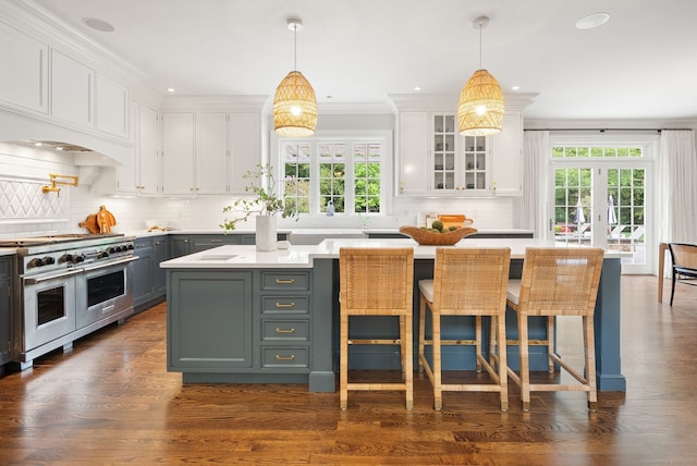kitchen with range with two ovens, white cabinetry, gray cabinets, recessed lighting, and crown molding