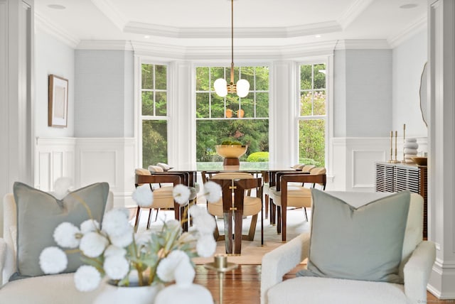 sunroom featuring a chandelier
