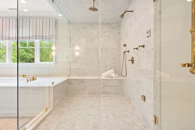 bathroom with a stall shower and recessed lighting