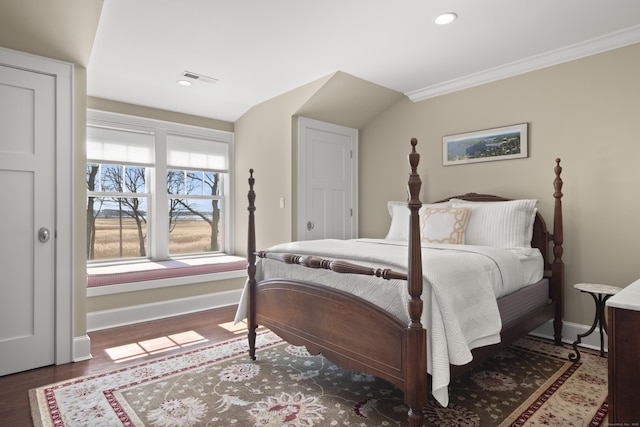 bedroom featuring baseboards, wood finished floors, visible vents, and recessed lighting