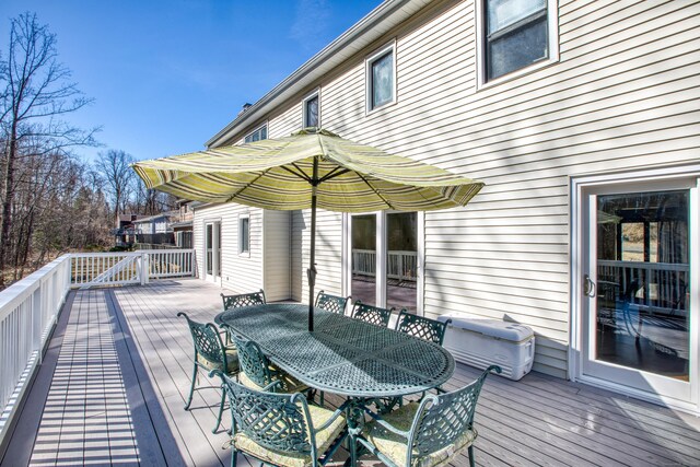wooden deck with outdoor dining space