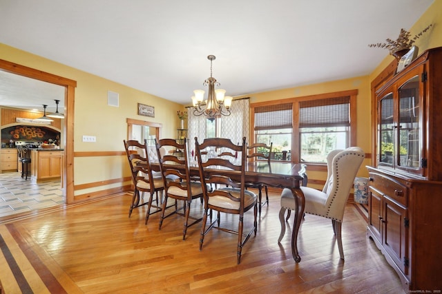 16 Fullmar Ln, Norwalk, CT 06850 - dining room featuring a chandelier, plenty of natural light, and light wood-style floors