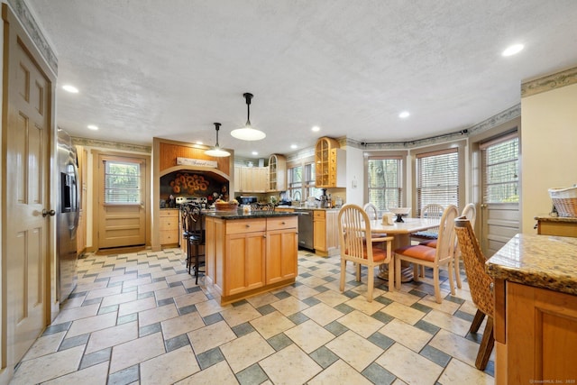 16 Fullmar Ln, Norwalk, CT 06850 - kitchen with appliances with stainless steel finishes, recessed lighting, glass insert cabinets, a center island, and a textured ceiling