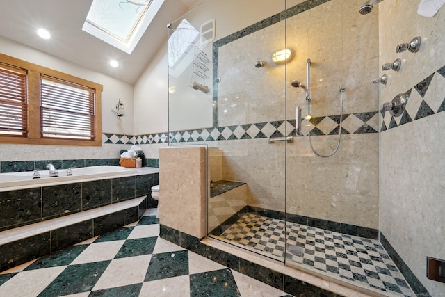 16 Fullmar Ln, Norwalk, CT 06850 - bathroom featuring a bath, tiled shower, tile walls, a skylight, and recessed lighting